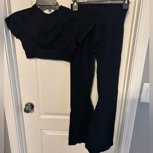 Women’s stretch athletic outfit with flare pants.
